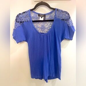 Blue knit top with spiderweb crochet lace
